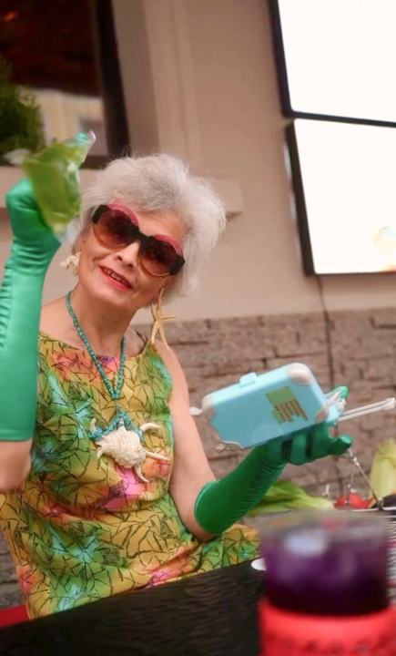 Aviasales granny with a cocktail